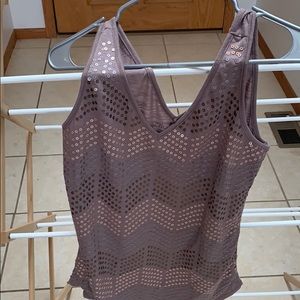 V neck in front and back.  Sequins in front.